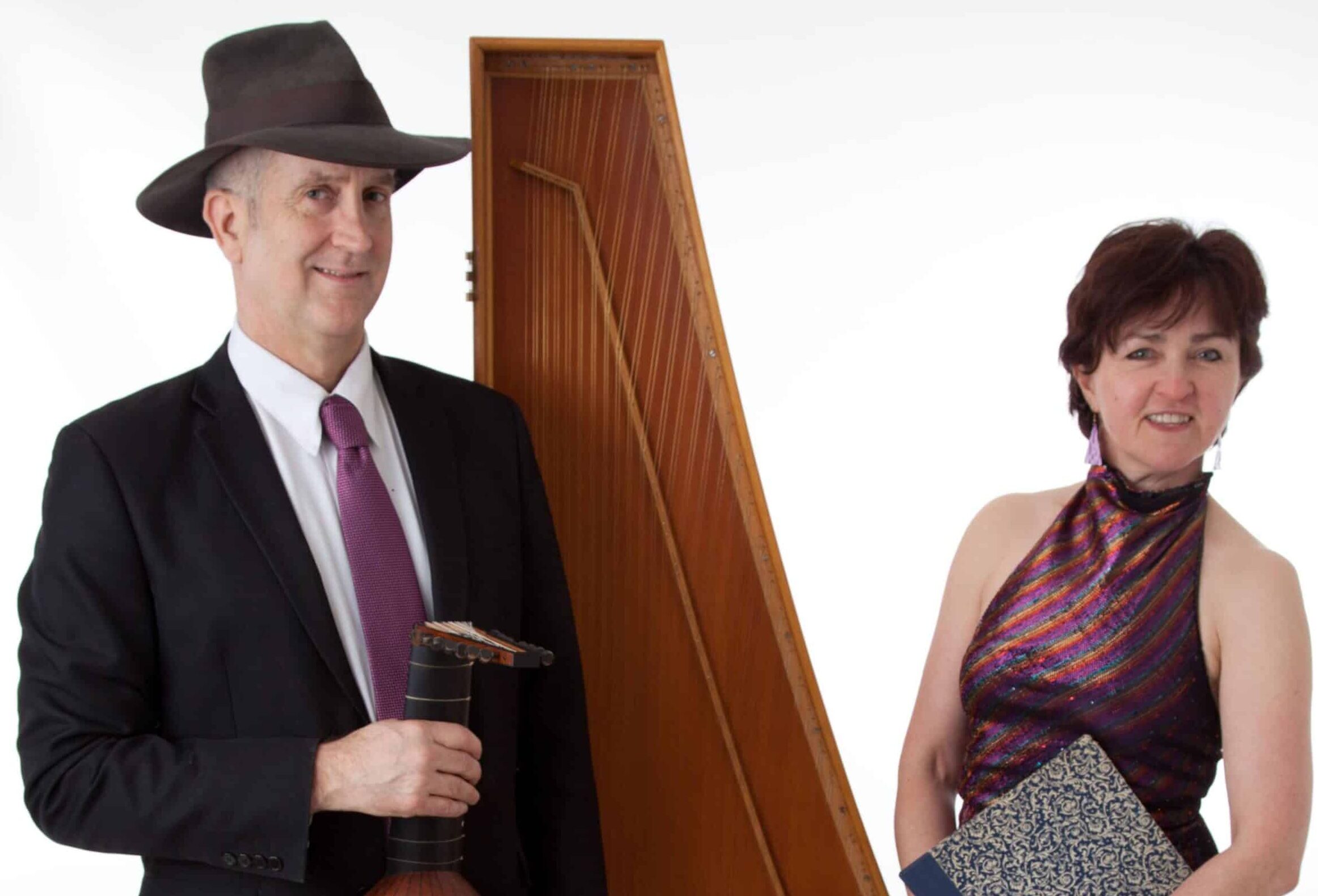 Matthew and Sara standing side by side with instruments