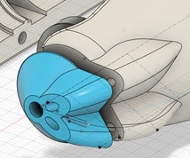 Detail of the case modifications that route the light guides to the sample, and the nozzle section (blue).