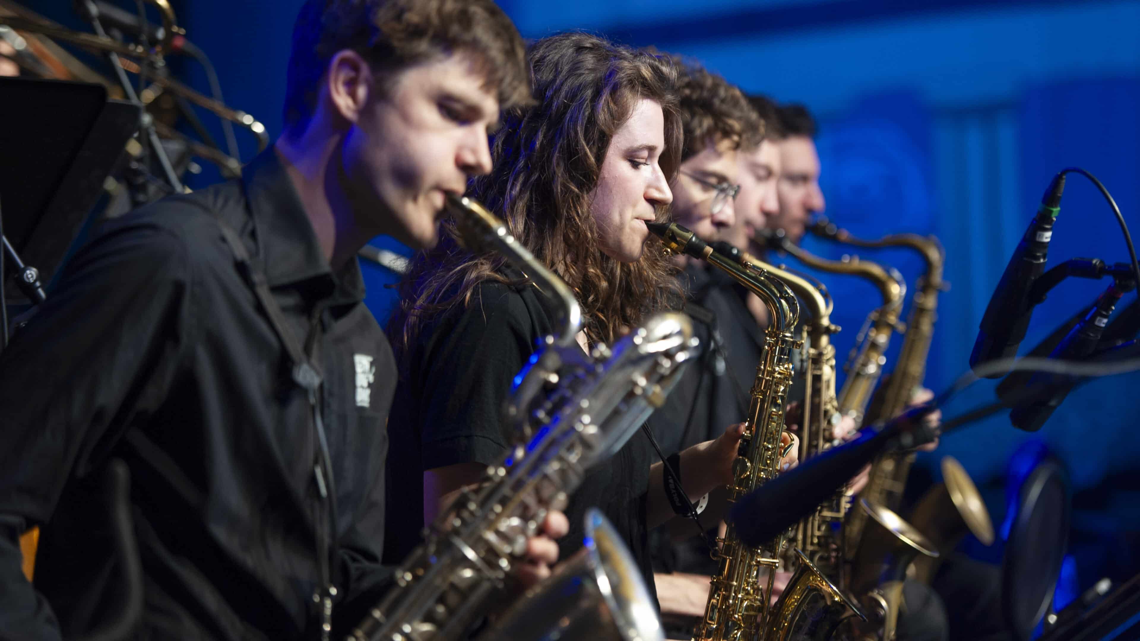 Close up of the saxophone players from the big band