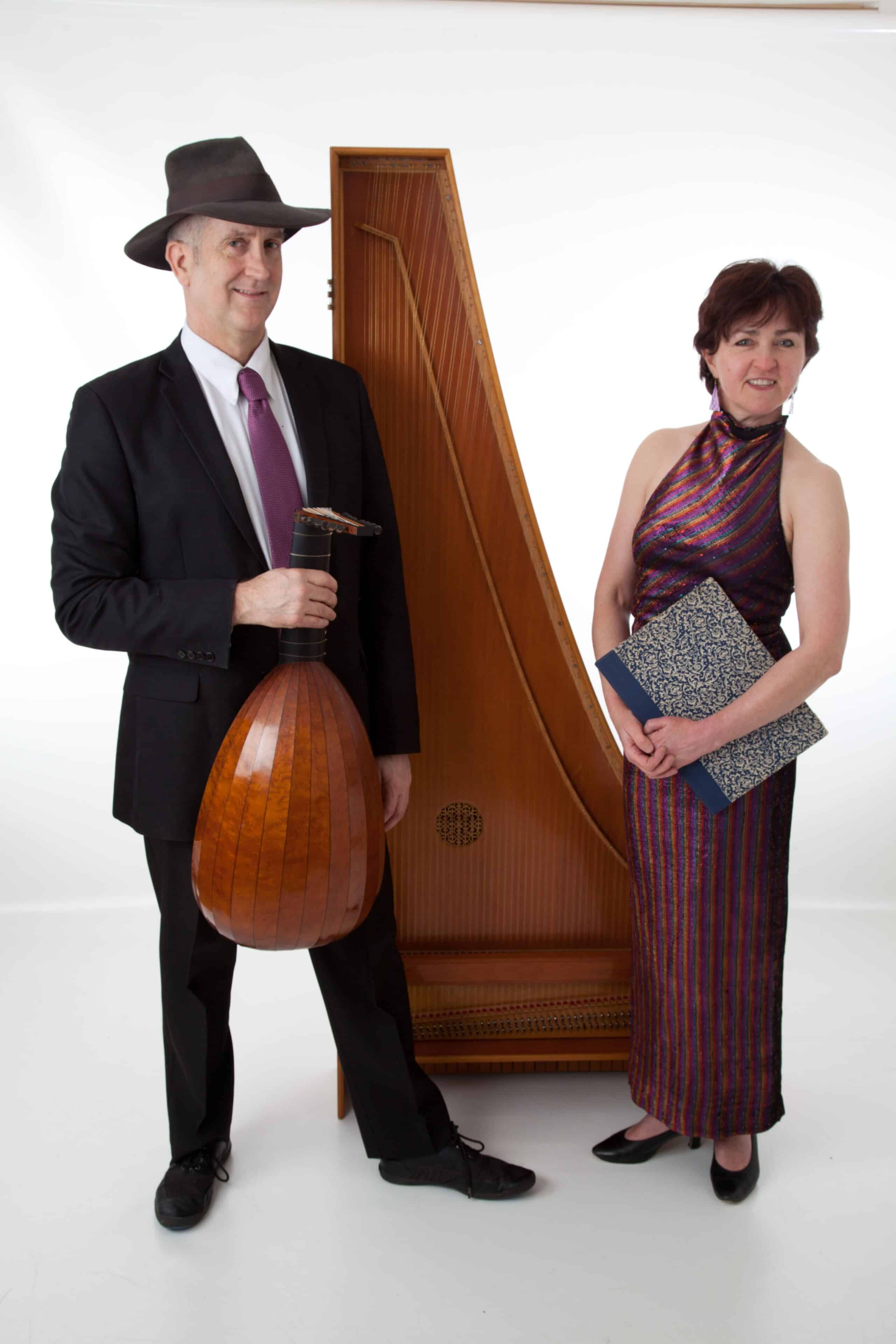 Matthew and Sara standing side by side with instruments